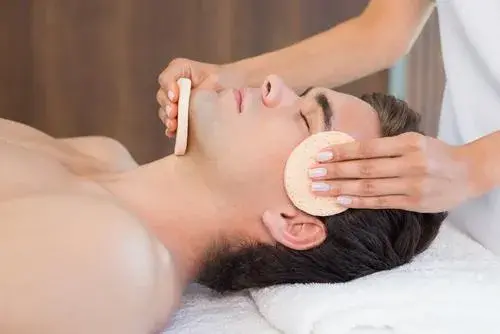 man-receiving-face-massage